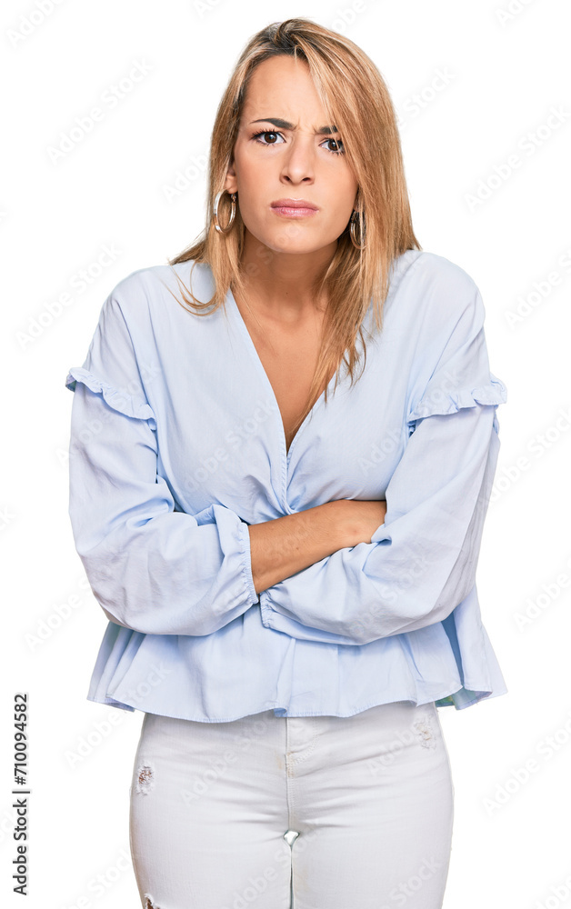 Beautiful blonde business woman wearing casual clothes skeptic and nervous, disapproving expression on face with crossed arms. negative person. Beautiful blonde business woman wearing casual clothes skeptic and nervous, disapproving expression on face with crossed arms. negative person.