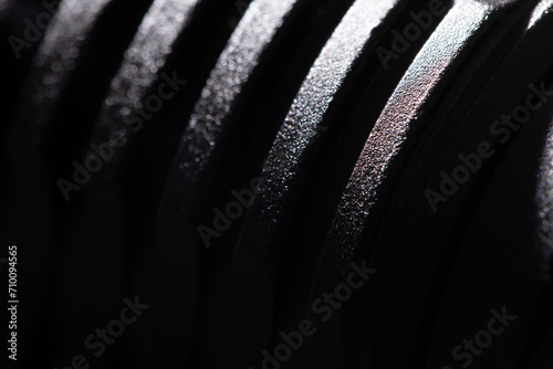 Texture of a black metal part close-up. Black powder metal, macro photography, fine detail