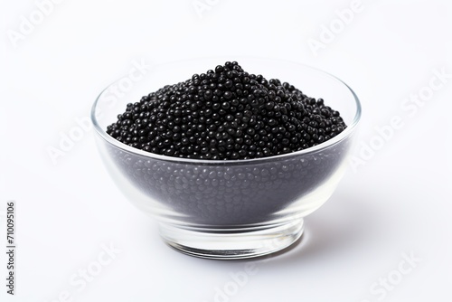 Fresh black caviar in bowl on white background