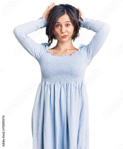 Young beautiful girl wearing casual clothes doing bunny ears gesture with hands palms looking cynical and skeptical. easter rabbit concept. photo