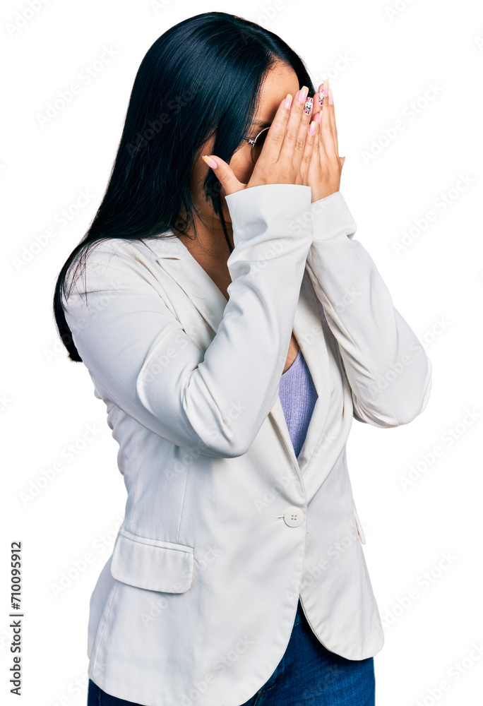 Beautiful hispanic woman with nose piercing wearing business jacket and glasses with sad expression covering face with hands while crying. depression concept. Beautiful hispanic woman with nose piercing wearing business jacket and glasses with sad expression covering face with hands while crying. depression concept.
