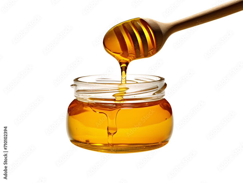 a honey dripping from a wooden spoon into a jar a honey dripping from a wooden spoon into a jar