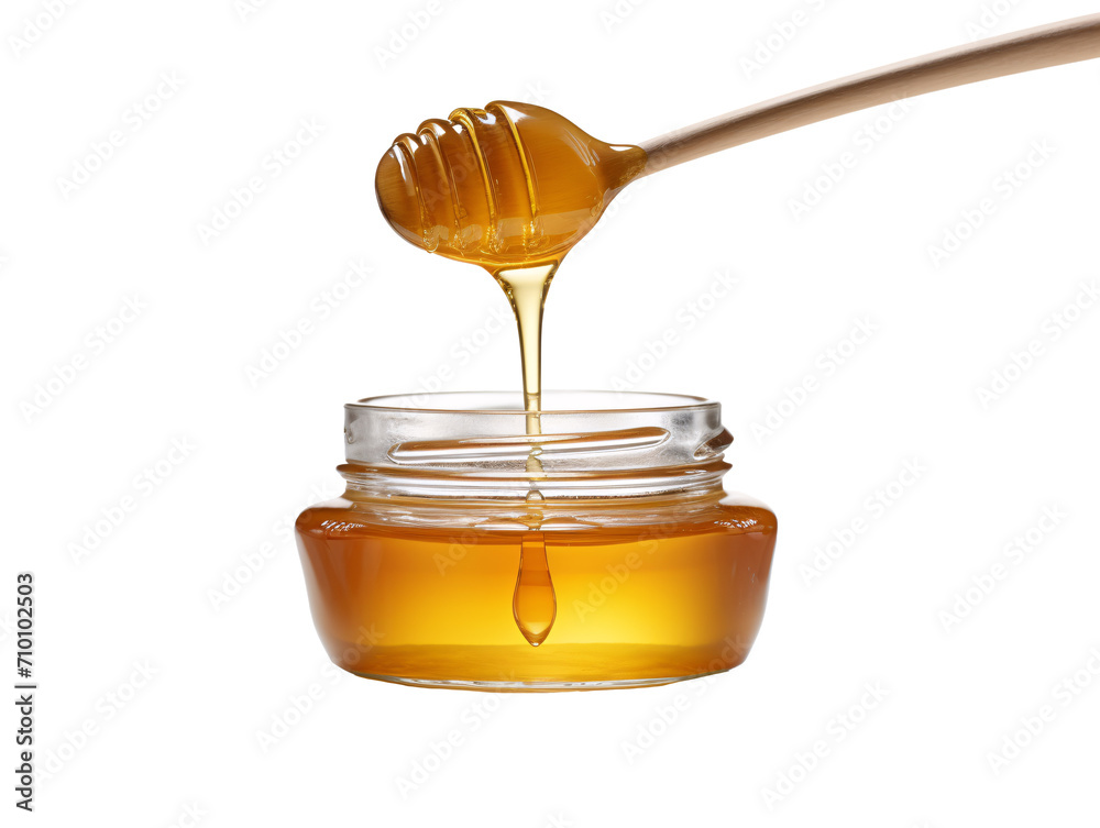 a honey dripping from a wooden spoon into a jar a honey dripping from a wooden spoon into a jar