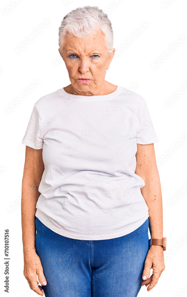 Senior beautiful woman with blue eyes and grey hair wearing casual white tshirt depressed and worry for distress, crying angry and afraid. sad expression. Senior beautiful woman with blue eyes and grey hair wearing casual white tshirt depressed and worry for distress, crying angry and afraid. sad expression.