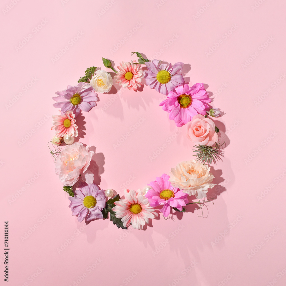 Romantic wreath of delicate spring flowers, flat lay composition with creative copy space.