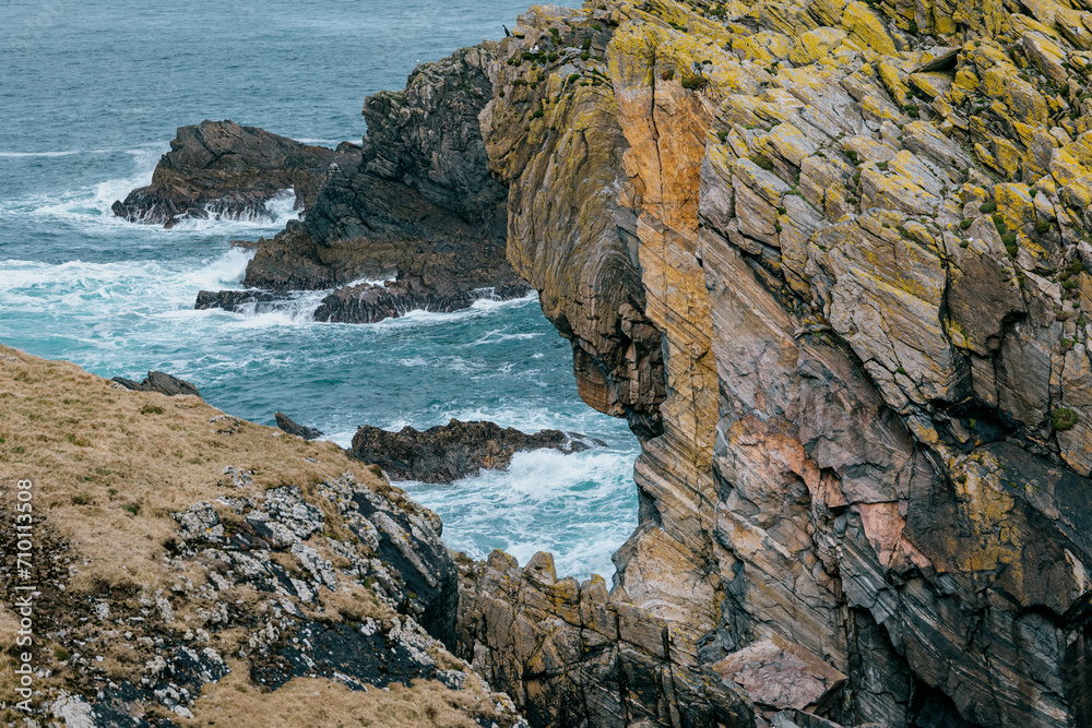 Rocky cliffs over Atlantic Ocean off Isle of Lewis, Outer Hebrides of Scotland