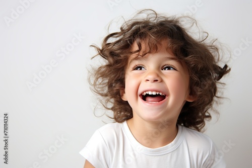 Portrait of cute child on white background © Alina