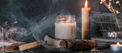 фотографія Tarot, astrology,Esoteric, Occult mystical ritual scene of sorcery tarot candles,dried flowers, palo santo tarot cards, ritual book