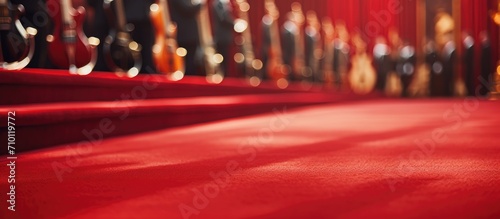 Musicians outside, closeup view of a red carpet. photo