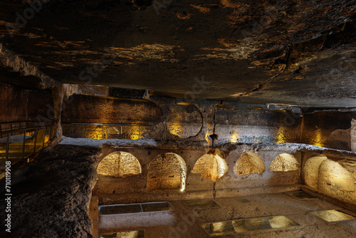 Dara ruins is an ancient city consisting of many interconnected caves in rocks. Dara Ancient City. Mesopotamia. Mardin, Turkey. The Gallery of Dara Ancient City, a huge rock-cut tomb.