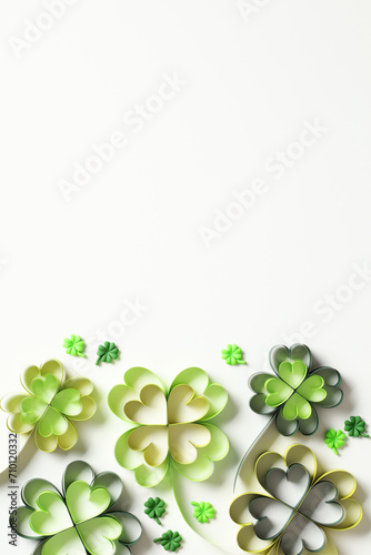 St Patrick's Day vertical banner design. Top view handmade papercut four leaf clover on white background. Flat lay.