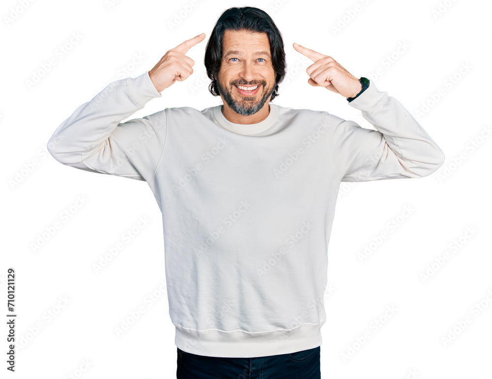 Middle age caucasian man wearing casual clothes smiling pointing to head with both hands finger, great idea or thought, good memory Middle age caucasian man wearing casual clothes smiling pointing to head with both hands finger, great idea or thought, good memory