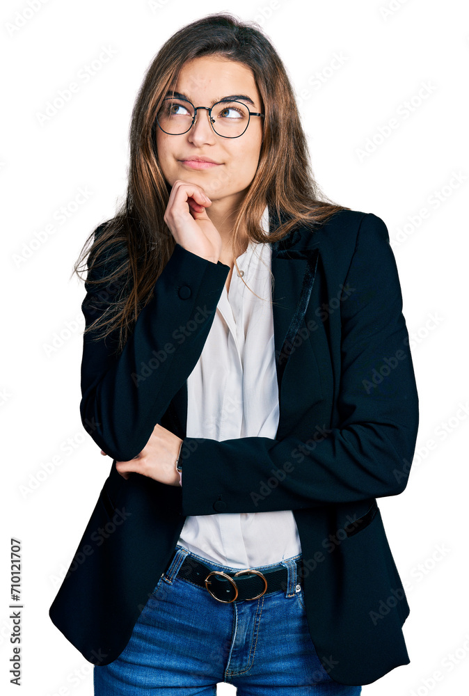Young caucasian girl wearing business style and glasses with hand on chin thinking about question, pensive expression. smiling and thoughtful face. doubt concept. Young caucasian girl wearing business style and glasses with hand on chin thinking about question, pensive expression. smiling and thoughtful face. doubt concept.