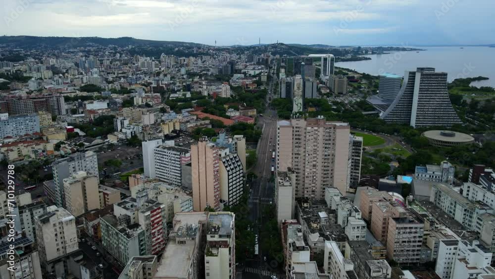 Aerial shot drone flies high over city toward south on cloudy day Aerial shot drone flies high over city toward south on cloudy day