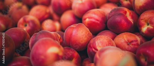 Sea of ripe nectarines bathed in soft light, a tapestry of blush and golden tones