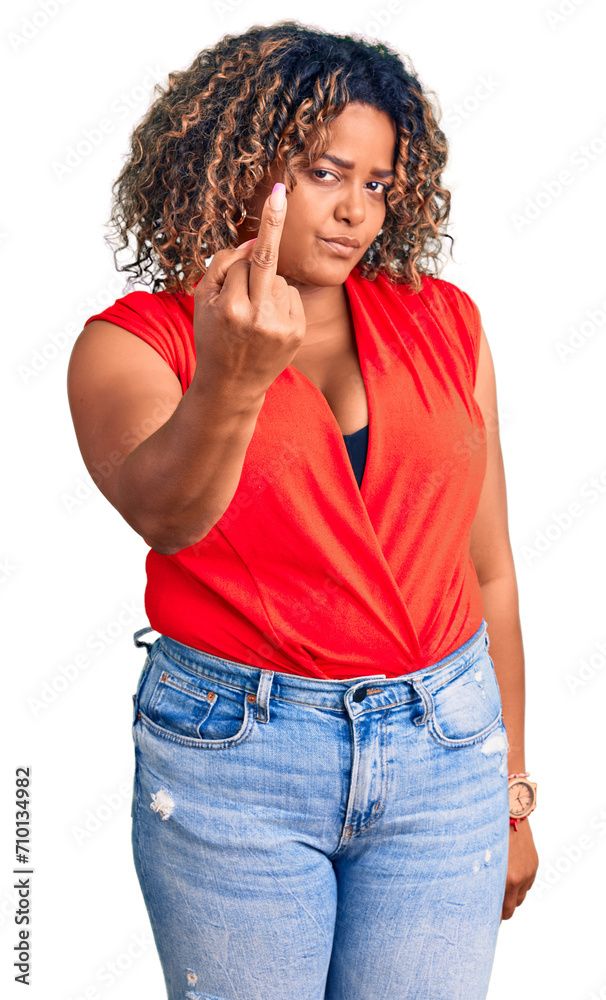 Young african american plus size woman wearing casual style with sleeveless shirt showing middle finger, impolite and rude fuck off expression Young african american plus size woman wearing casual style with sleeveless shirt showing middle finger, impolite and rude fuck off expression