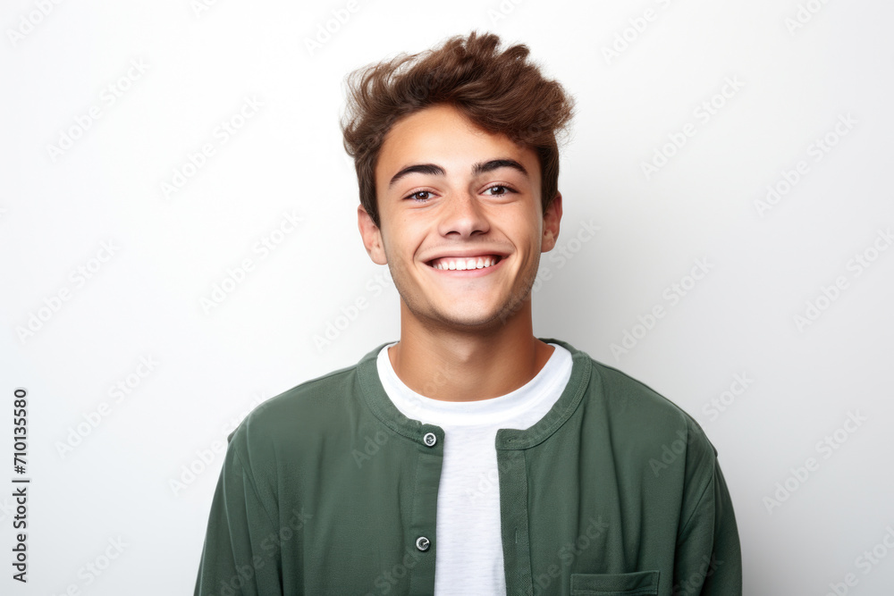 Man wearing green jacket smiles at camera. Suitable for various applications. Man wearing green jacket smiles at camera. Suitable for various applications.