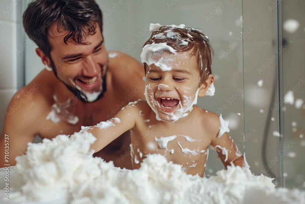 Father and son have fun with shaving foam in the bathroom Father and son have fun with shaving foam in the bathroom