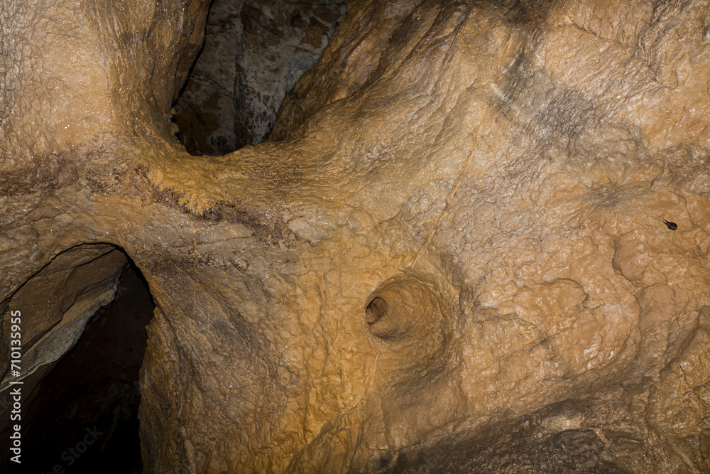 Obraz premium Speleology. The Bacho Kiro cave, Dryanovo, Bulgaria. Stalactite, and stalagmite speleothem formations.