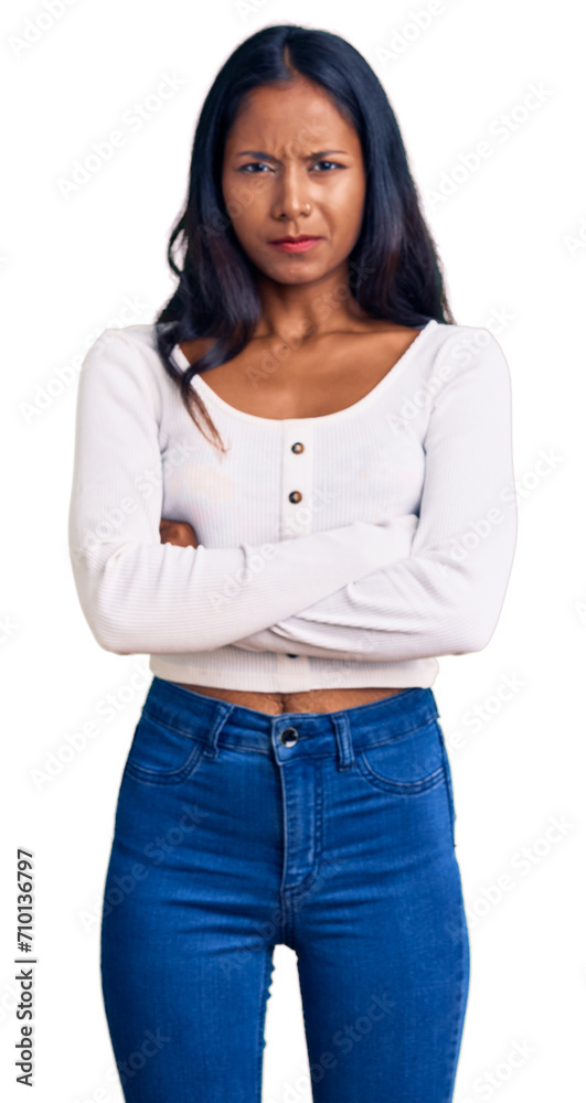 Young indian girl wearing casual clothes skeptic and nervous, disapproving expression on face with crossed arms. negative person. Young indian girl wearing casual clothes skeptic and nervous, disapproving expression on face with crossed arms. negative person.