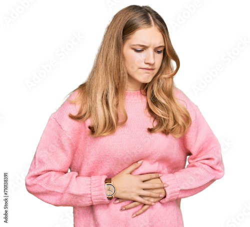 Beautiful young caucasian girl wearing casual winter sweater with hand on stomach because indigestion, painful illness feeling unwell. ache concept. © Krakenimages.com