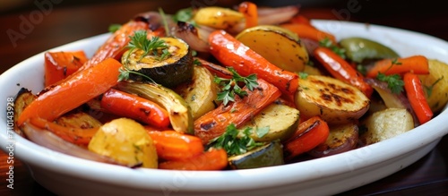 Assorted oven-roasted veggies: carrots, onion, zucchini, bell pepper.