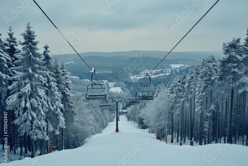A ski lift ascending a snow-covered hill. Perfect for winter sports and outdoor activities