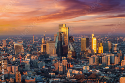 Elevated, panoramic view of the urban skyline of the skyscrapers at the City of London during a colorful sunrise, England