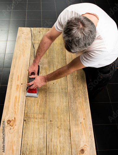 Sanding machine in male hand photo