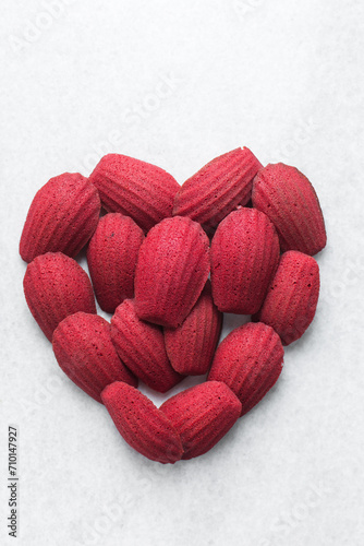 Top view of Red velvet madeleines on a marble tray shaped like a heart  red madeleines cake or cookies for valentines