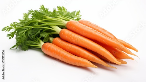 Bunch of fresh carrots with tops on white background. Carrots with tops. Food photography. Horizontal format