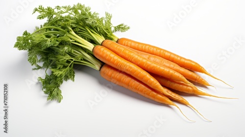 Bunch of carrots with tops isolated on white background. Carrots with tops. Food photography. Horizontal format