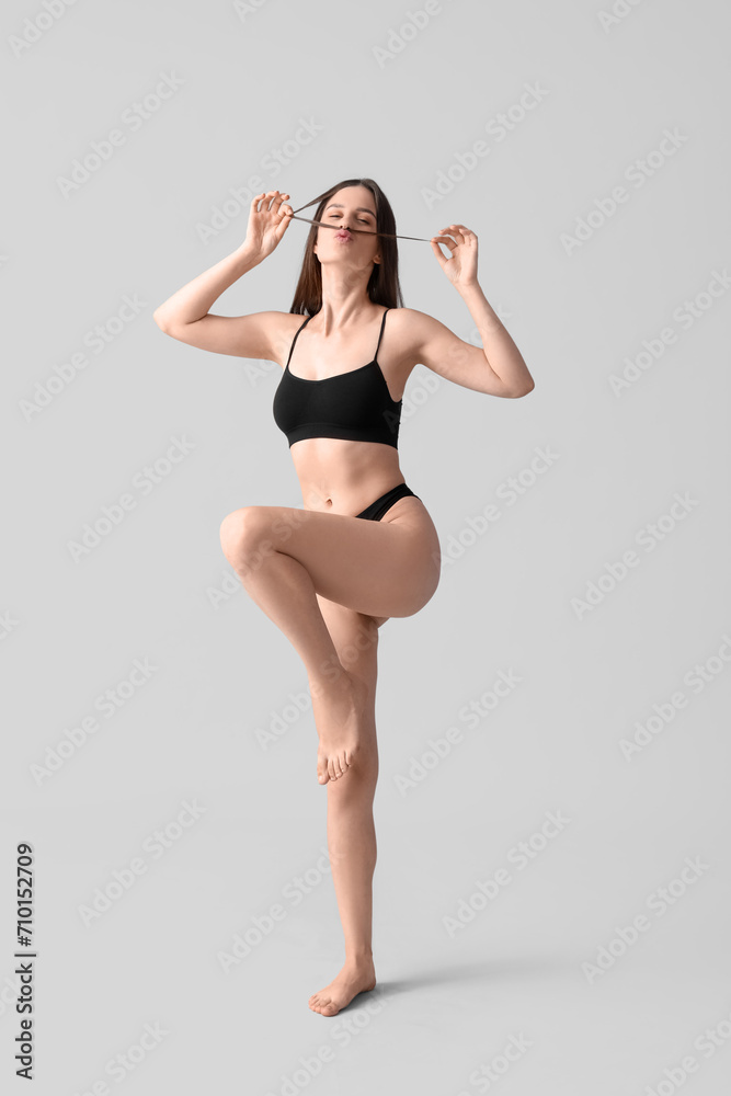 Body positive woman in underwear on light background Body positive woman in underwear on light background