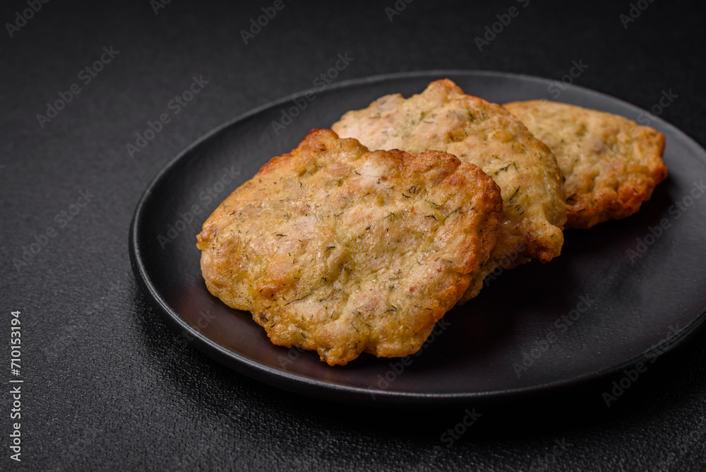 Delicious juicy fried chicken or pork pancakes with salt, spices and herbs