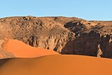 View Playa of Moul Naga, of the Tadrart Rouge rocky mountain range in Tassili n Ajjer National Park. Sahara desert, Algeria, Africa.