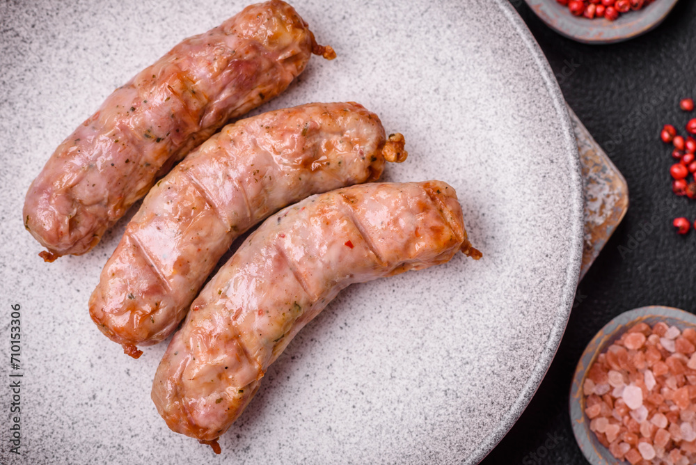 Delicious juicy grilled chicken or pork sausages with salt, spices and herbs Delicious juicy grilled chicken or pork sausages with salt, spices and herbs