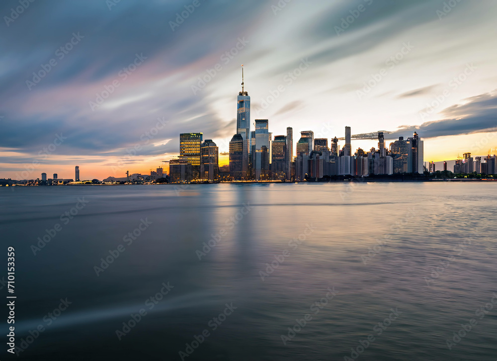 New York City. Manhattan downtown skyline skyscrapers at sunset.