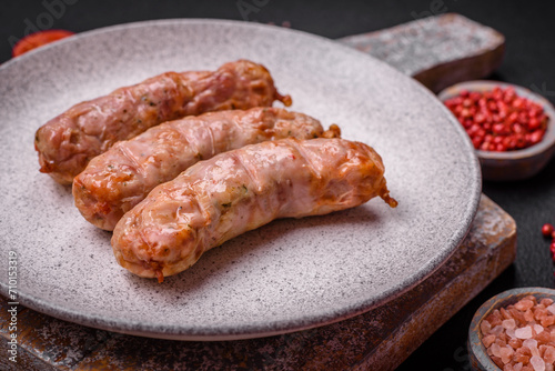 Delicious juicy grilled chicken or pork sausages with salt, spices and herbs