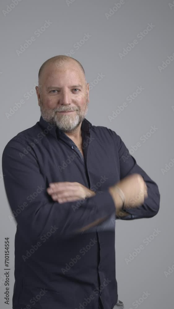 Portrait of well dressed man in studio with positive attitude looking into camera. Portrait of well dressed man in studio with positive attitude looking into camera.