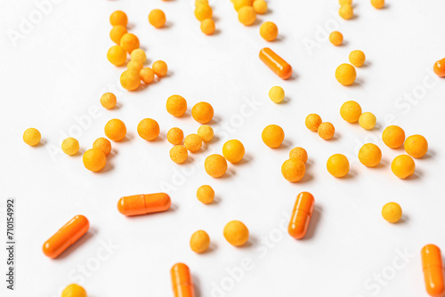 Many different pills on white background