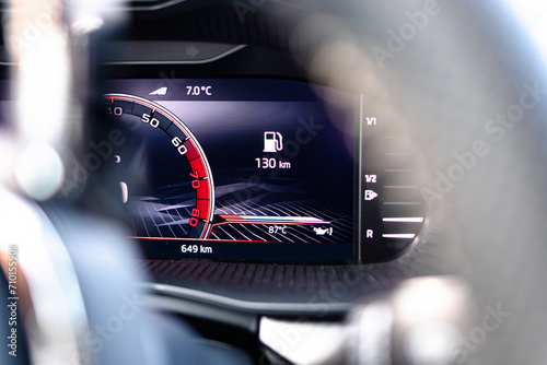 Fuel autonomy on a screen display dashboard interior car vehicle photo