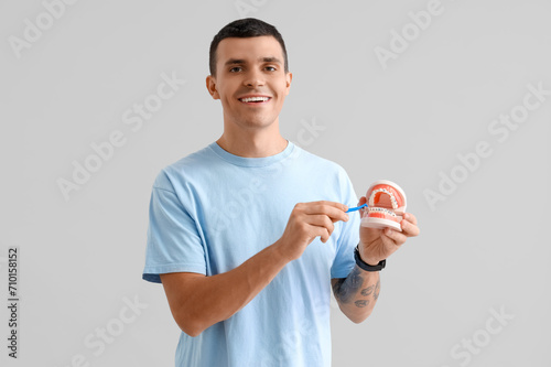 Handsome young man holding ...