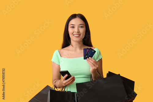 Smiling young woman holding...
