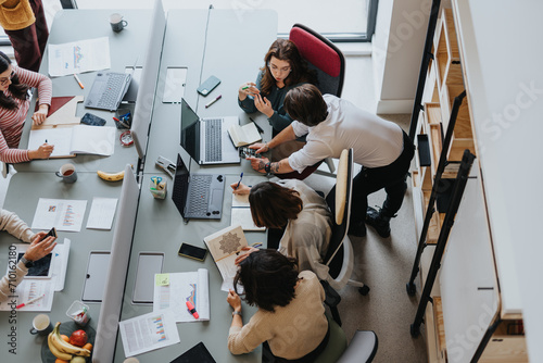 Diverse coworkers collaborating in a modern office. Successful teamwork and productive solutions. Multicultural environment for entrepreneurs and startup teams.