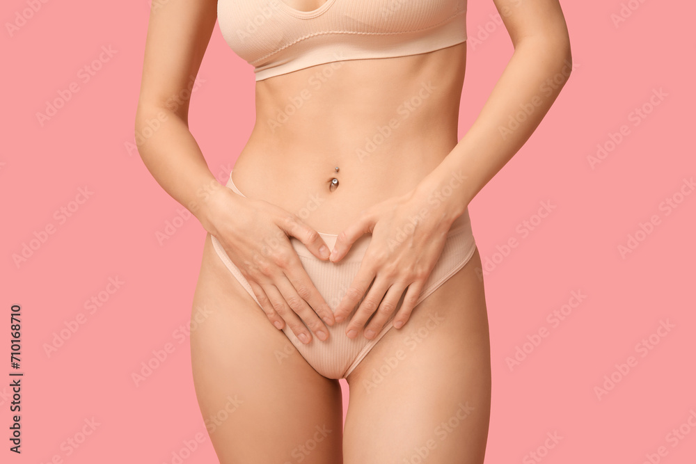 Beautiful young woman in underwear on pink background Beautiful young woman in underwear on pink background