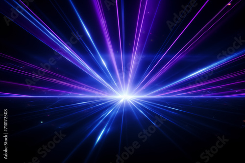 Blue and violet beams of bright laser light shining on black background © Nadtochiy
