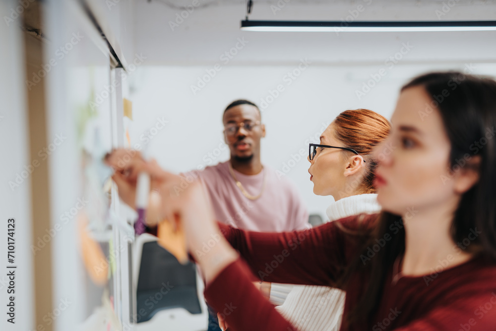 Group of creative professionals collaborating and brainstorming in a corporate office. Group of creative professionals collaborating and brainstorming in a corporate office.