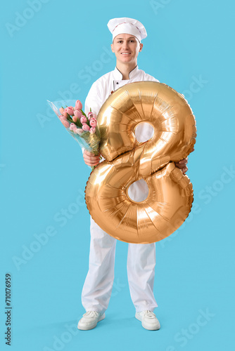 Male chef with tulips and b...