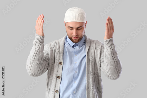 Young Muslim man praying on...