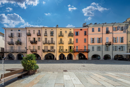 Cuneo, Piedmont, Italy - August 16, 2023: Cityscape on Via Roma, main cobblestone pedestrian street with colorful old buildings and with arcade in historic center photo